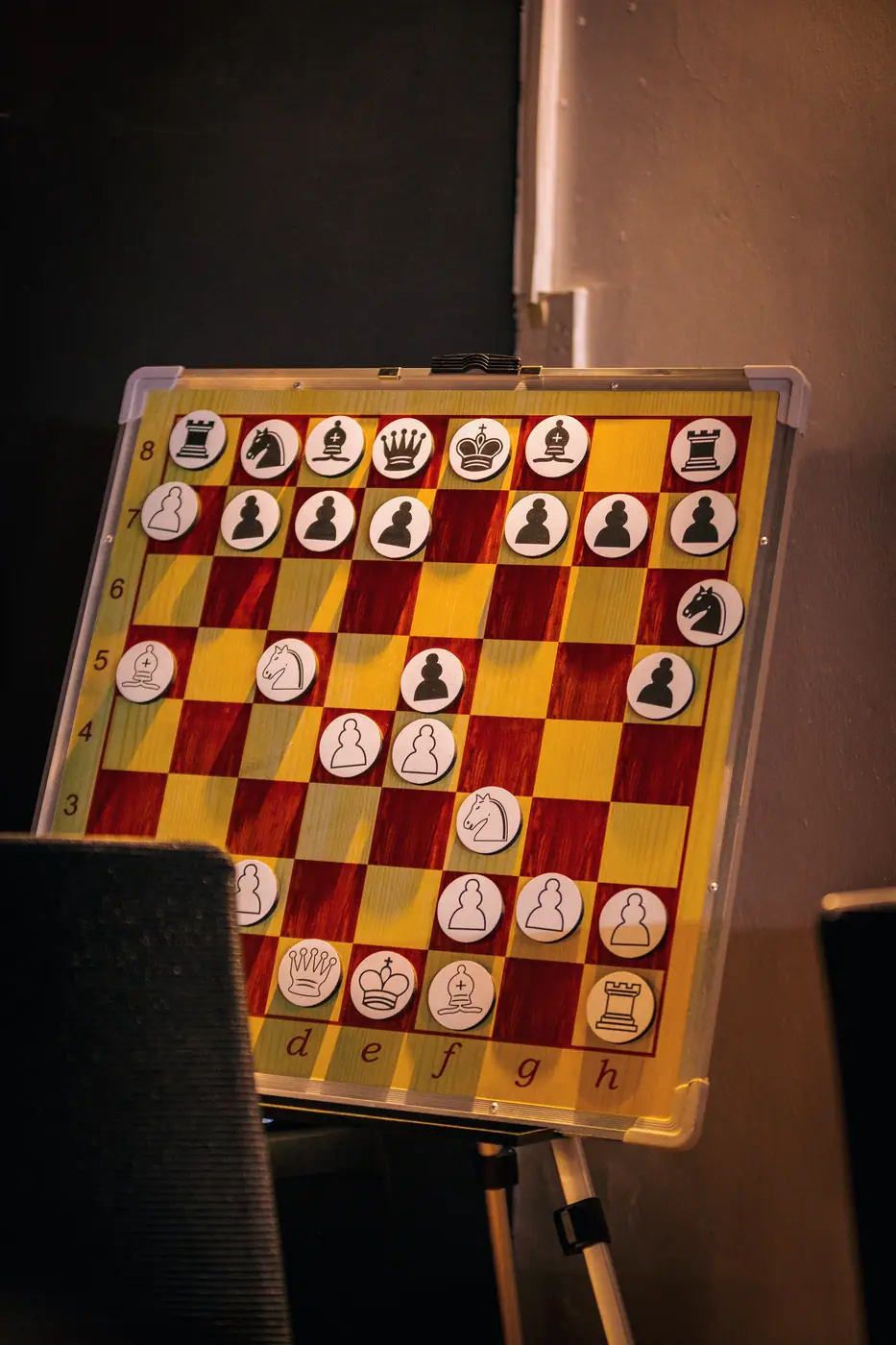 A magnetic demonstration board on an easel in warm light